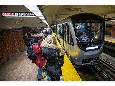 The new Metro AZUR train cars arrive at Henri-Bourassa metro as camera shutters click for the first public ride in the orange line in Montreal on Sunday, February 7, 2016.