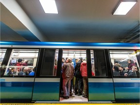 Passengers wait inside the new AZUR metro train as it leaves Berri-UQAM station on the train's first public ride on the orange line in Montreal on Sunday, February 7, 2016.