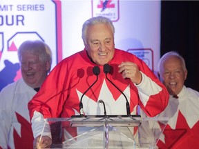 Former 1972 Team Canada member, Phil Esposito talks at a press conference in Montreal Tuesday, February 9, 2016 (behind are teammates Pat Stapleton (left) and Yvan Cournoyer) to announce the '72 Summit Series Tour. Team members from the classic hockey series in 1972, which pitted top Canadian players against top Soviet Union players, will be touring Canadian cities to talk about their experiences 44 years ago.