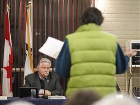 Rigaud Mayor Hans Gruenwald Jr. listens to David Hill, a resident of nearby St-Lazare and a self-described environmentalist, on Monday night during the question period at Rigaud city council. Hill brought a petition asking for a halt to development on Rigaud Mountain.(Marie-France Coallier / MONTREAL GAZETTE)