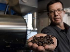Christian Lacroix of Lenoir Lacroix displays freshly roasted beans in Blainville, north of Montreal, on Wednesday January 27, 2016.