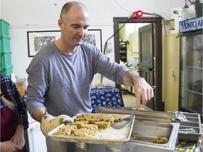 Brian Lott volunteers at the NDG Food Depot, serving lunches that incorporate ingredients found in the food baskets distributed to clients.