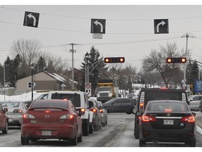 The signs drivers see as they arrive at Pierrefonds Blvd. from the Ile-Bizard. Motorists cannot go south on Jacques-Bizard here. They are forced to turn east or west on Pierrefonds Blvd. (Marie-France Coallier / MONTREAL GAZETTE)