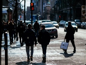 A view of pedestrians on St-Catherine street near the corner of Drummond street in downtown Montreal on Tuesday, March 10, 2015.