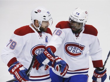 Montreal Canadiens defenceman Andrei Markov, left, of Russia, celebrates scoring a goal with defenceman P.K. Subban against the Colorado Avalanche in the first period go an NHL hockey game Wednesday, Feb. 17, 2016, in Denver.