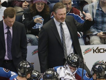 Colorado Avalanche head coach Patrick Roy directs his players during a time out against the Montreal Canadiens in the first period of an NHL hockey game Wednesday, Feb. 17, 2016, in Denver.
