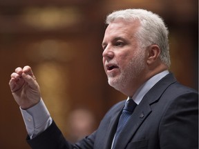 Quebec Premier Philippe Couillard responds to the Oppositions during question period, at the legislature in Quebec City on Tuesday, Feb. 9, 2016.