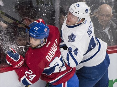 Montreal Canadiens' Phillip Danault (24) collies with Toronto Maple Leafs' Morgan Rielly (44) during first period NHL hockey action in Montreal, Saturday, February 27, 2016.