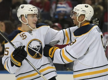 Buffalo Sabres defenceman Rasmus Ristolainen (55) celebrates with teammate Evander Kane (9) after Kane scored during the third period of an NHL hockey game against the Montreal Canadiens, Friday, Feb. 12, 2016 in Buffalo, N.Y. Buffalo won 6-4.