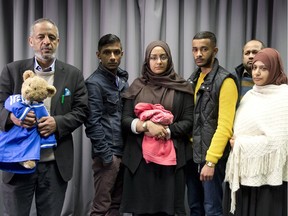 The families of Amira Abase and Shamima Begum, missing schoolgirls believed to have fled to Syria to join Islamic State, pose after being interviewed by the media at New Scotland Yard, after pleading for them to return home, on February 22, 2015 in London, England.
