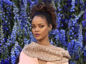FILE - In this Friday, Oct. 2, 2015, file photo, singer Rihanna poses before Christian Dior's Spring-Summer 2016 ready-to-wear fashion collection to be presented during the Paris Fashion Week, in Paris. Rihanna has released her much anticipated new album through Jay Z's Tidal streaming service, which she co-owns. Rihanna released "ANTI" on Thursday, Jan. 28, 2016, on the streaming service.