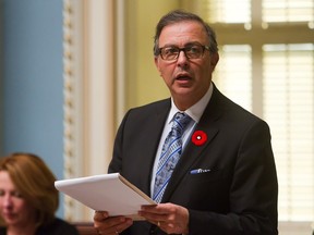 Sam Hamad, then minister of Labour, presents a bill to the Quebec legislature, Tuesday Nov. 10, 2015.  On Jan. 28, he became president of the Treasury  Board. Dominique Vien is the new minister responsible for Labour.