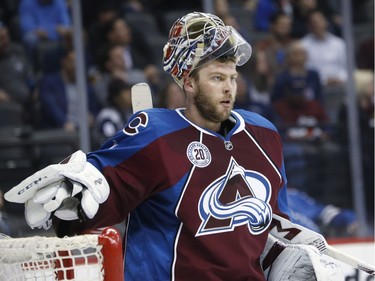 Colorado Avalanche goalie Semyon Varlamov, of Russia, reacts after giving up a goal to the Montreal Canadiens in the second period of an NHL hockey game Wednesday, Feb. 17, 2016, in Denver.