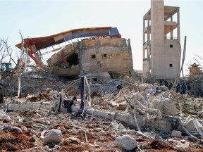 A picture shows the rubble of a hospital supported by Doctors Without Borders (MSF) near Maaret al-Numan, in Syria's northern province of Idlib, on February 15, 2016, after the building was hit by suspected Russian air strikes. MSF confirmed in a statement that a hospital supported by the aid group in Idlib province was "destroyed in air strikes".