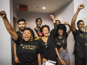 A group of Black Lives Matter protesters interrupt a police services board meeting in Toronto, Thursday July 16, 2015.