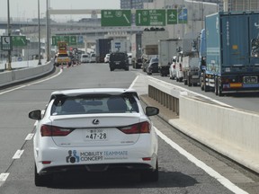 Toyota Motor Corp., automated driving test vehicle enters a highway on-ramp in Tokyo, Tuesday, Oct. 6, 2015.  Toyota unveiled its vision for self-driving cars in a challenge to other automakers as well as industry newcomer Google Inc., promising to start selling such vehicles in Japan by 2020.
