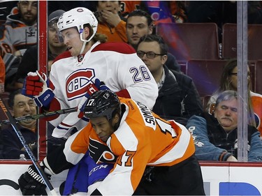 Philadelphia Flyers' Wayne Simmonds, right, collides with Montreal Canadiens' Jeff Petry during the first period of an NHL hockey game, Tuesday, Feb. 2, 2016, in Philadelphia.