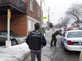 SQ and Montreal police conduct a drug raid at a house on Amos Street in Montreal North, Wednesday March 9, 2016. The raid was part of a broader operation around the Montreal area spearheaded by the SQ and assisted by municipal police forces.