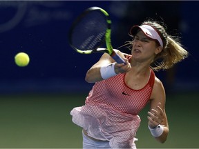 Eugenie Bouchard of Canada plays a return shot to Cagla Buyukakcay of Turkey during the Quarter Finals of the 2016 BMW Malaysian Open at Kuala Lumpur Golf and Country Club on March 4, 2016 in Kuala Lumpur, Malaysia.