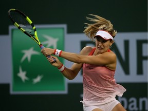 Eugenie Bouchard of Canada returns a shot against Sloane Stephens during the BNP Paribas Open at the Indian Wells Tennis Garden on March 11 at Indian Wells Tennis Garden on March 12, 2016 in Indian Wells, California