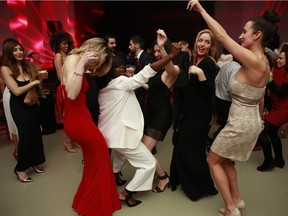 Guests get down to some highly danceable tunes at the recent "A Rare Evening: A Touch of Red" Benefit Event for the iBellieve Foundation.