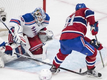 Montreal Canadiens' Lars Eller moves in on New York Rangers goaltender Antti Raanta during first period NHL hockey action in Montreal, Saturday, March 26, 2016.