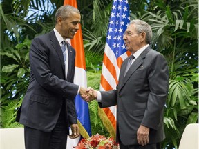 President Barack Obama shakes hands with Cuban President Raul Castro during their meeting at the Palace of the Revolution in Havana, Cuba, on March 21, 2016.