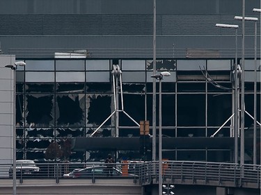 This view taken on March 22, 2016 shows the broken glasses at Brussels Airport in Zaventem after a two explosions targeted the main hall. A string of explosions rocked Brussels airport and a city metro station today, killing at least 13 people, according to media reports, as Belgium raised its terror threat to the maximum level.