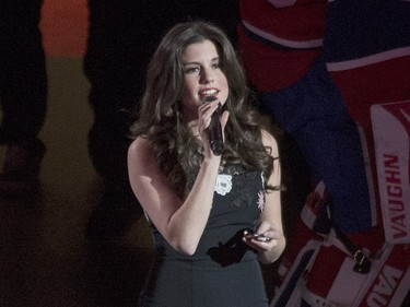 Brittany Kennell sings the U.S. and Canadian national anthem's prior to an NHL hockey game between the Montreal Canadiens and the New York Rangers in Montreal on Saturday, March 26, 2016.