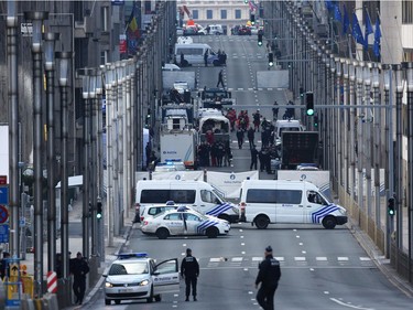 oldiers and police officers patrol outside Maelbeek metro station following todays attack on March 22, 2016 in Brussels, Belgium.