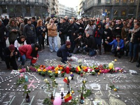 People leave tributes at the Place de la Bourse following today's attacks on March 22, 2016 in Brussels, Belgium.