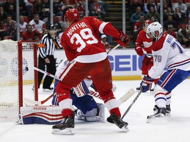 Detroit Red Wings right wing Anthony Mantha (39) scores on Montreal Canadiens goalie Ben Scrivens (40) in the second period of an NHL hockey game, Thursday, March 24, 2016 in Detroit.