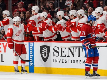MONTREAL, QC - MARCH 29:  Gustav Nyquist #14 of the Detroit Red Wings celebrates his goal with teammates during the NHL game against the Montreal Canadiens at the Bell Centre on March 29, 2016 in Montreal, Quebec, Canada.