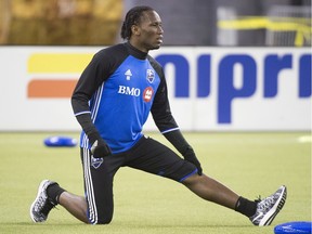 Montreal Impact's Didier Drogba stretches during a training session in Montreal, Tuesday, March 1, 2016, ahead of the Impact's season opener against the Vancouver Whitecaps on March 6.