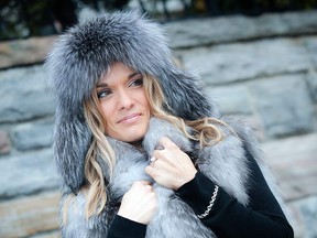 Marie-Josée Noury is cosy and chic wrapped in a delicate feathered grey fox vest and aviator-style leather and indigo fox hat from Tremblant’s Scada Furs. The three-carat Canadian diamond solitaire and white gold ring and 18-karat white gold and diamond bracelet is from Joaillerie St-Onge.