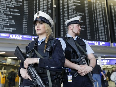 German police officers guard  a terminal of the airportthe  in Frankfurt, Germany, during tighter security measures  Tuesday, March 22, 2016, when various explosions hit the the Belgian capital  Brussels killing several people.