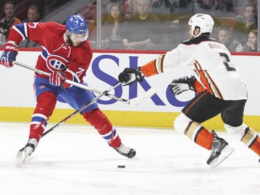 Alex Galchenyuk puts a move on Anaheim Ducks' Kevin Bieksa during first- period action in Montreal Tuesday, March 22, 2016.