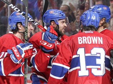 Lucas Lessio, second from left, celebrates his game-winning goal against the Anaheim Ducks with teammates Joel Hanley, left, Mike Brown and Jacob De La Rose during third period in Montreal Tuesday, March 22, 2016.