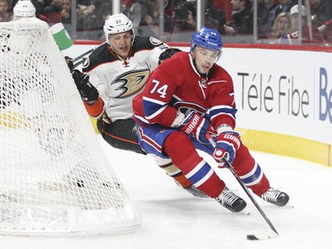 Defenceman Alexei Emelin is pursued around the Habs net by Anaheim Ducks' Shawn Horcoff during second-period action in Montreal Tuesday, March 22, 2016.
