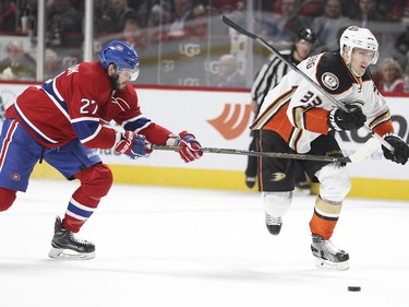 Alex Galchenyuk tries to slow down Anaheim Ducks' Jacob Silfverberg during second-period action in Montreal Tuesday, March 22, 2016.