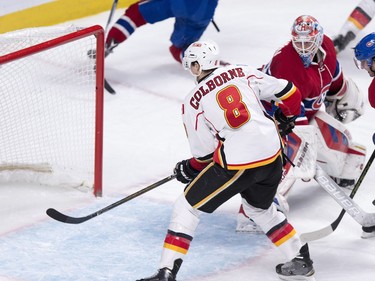 Calgary Flames' Joe Colborne scores on Mike Condon during second- period action Sunday, March 20, 2016, in Montreal.