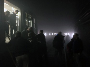 In this photo provided by EurActiv and photographed by Evan Lamos, passengers on the metro leave their carriages and walk along the tracks following an attack on the Brussels underground transport system in Brussels, Belgium, after an explosion, Tuesday, March 22, 2016.