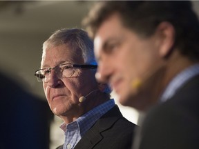 Jean-Pierre Leger, St-Hubert's chairman and CEO and a member of the company's founding family, speaks to reporters as Bill Gregson, chief executive officer of Cara, right, listens in Montreal Thursday, March 31, 2016.