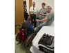 Before putting prosthetic legs on an 11-year old boy who lost his legs and an arm in East Ukraine, physiotherapist Rochelle Rein (left), Carlo Berretta, v.p. of J.E. Hanger orthotics-prosthetics, nurse orthopedic technician Stéphanie Thierry and cast technician Pierre Ouellet discuss marks along the scarline of one of Mykola Nyzhnykovskyi's amputated legs at Shriners Hospitals for Children in Montreal Tuesday, March 15, 2016. He sustained his grave injuries from an exploding grenade that killed his younger brother.