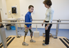 Mykola Nyzhnykovskyi takes a break as he works with physiotherapist Rochelle Rein at Shriners Hospitals for Children in Montreal Tuesday, March 15, 2016. Mykola lost his legs and an arm in East Ukraine and sustained other serious injuries from an exploding grenade that killed his younger brother.