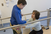 Mykola Nyzhnykovskyi works with physiotherapist Rochelle Rein at Shriners Hospitals for Children in Montreal Tuesday, March 15, 2016. Mykola lost his legs and an arm in East Ukraine and sustained other serious injuries from an exploding grenade that killed his younger brother.