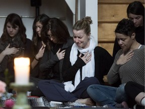 Family and friends of Kristin Johnston are emotional while holding a silent candlelight meditation in tribute to the slain yoga instructor at RIO HFX's studio in Halifax on Monday, March 28, 2016. Johnston was the victim of a homicide over the weekend and a person of interest is in custody in the hospital with non-life threatening injuries.