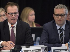 Louis Bergeron, left, and Stéphane Grenon, spokespeople for Energy East, at the opening of environment hearings on the Energie Est pipeline, Monday, March 7, 2016 in Lévis, Que.