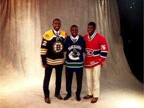 Malcolm Suban (left) poses with brothers Jordan (centre) and P.K. All three brothers were drafted by NHL teams.