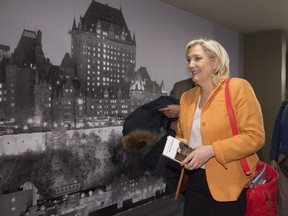 France Front National Leader Marine Le Pen leaves a news conference, Sunday, March 20, 2016 in Quebec City.